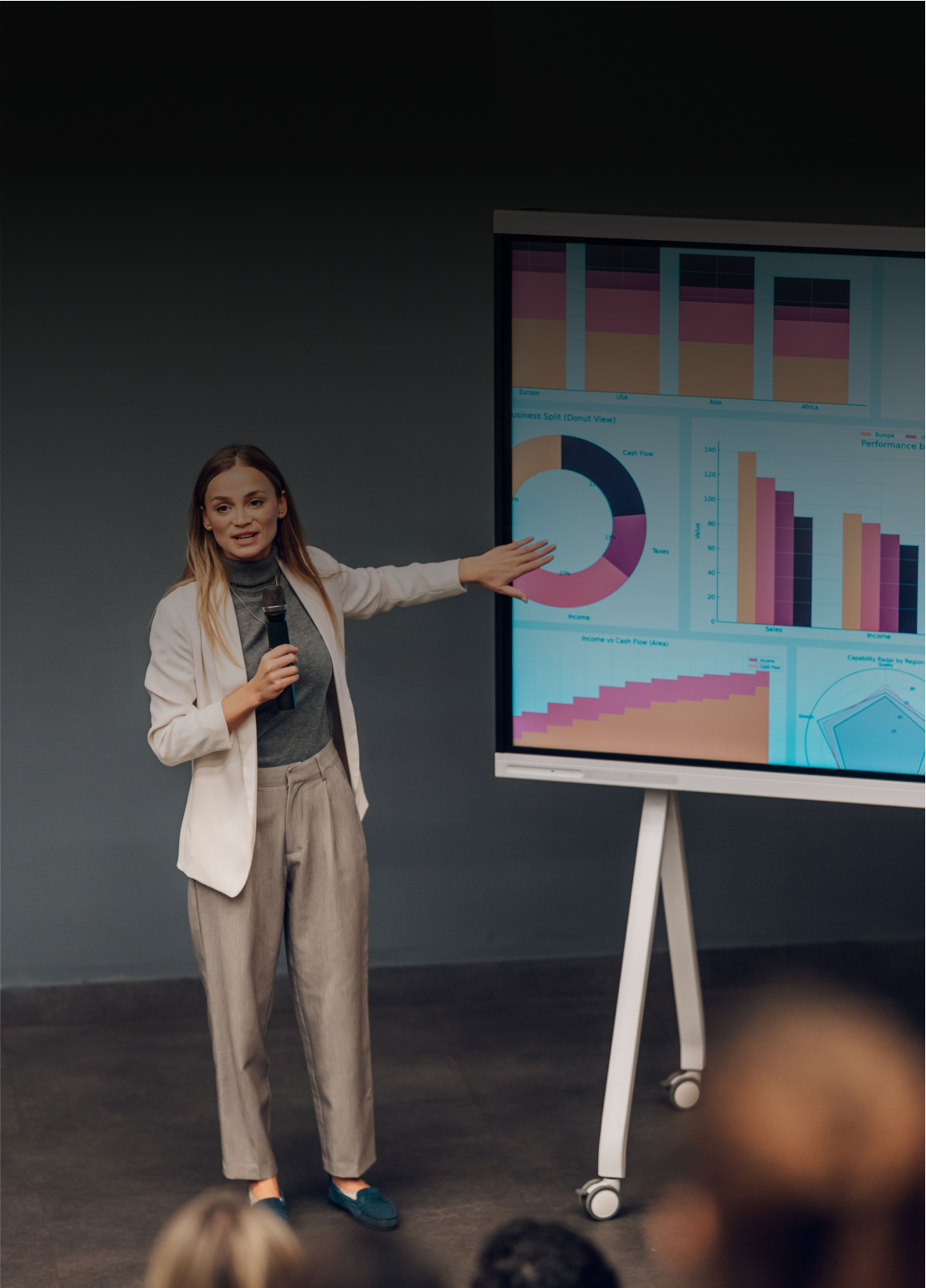Speaker explaining graphs to audience