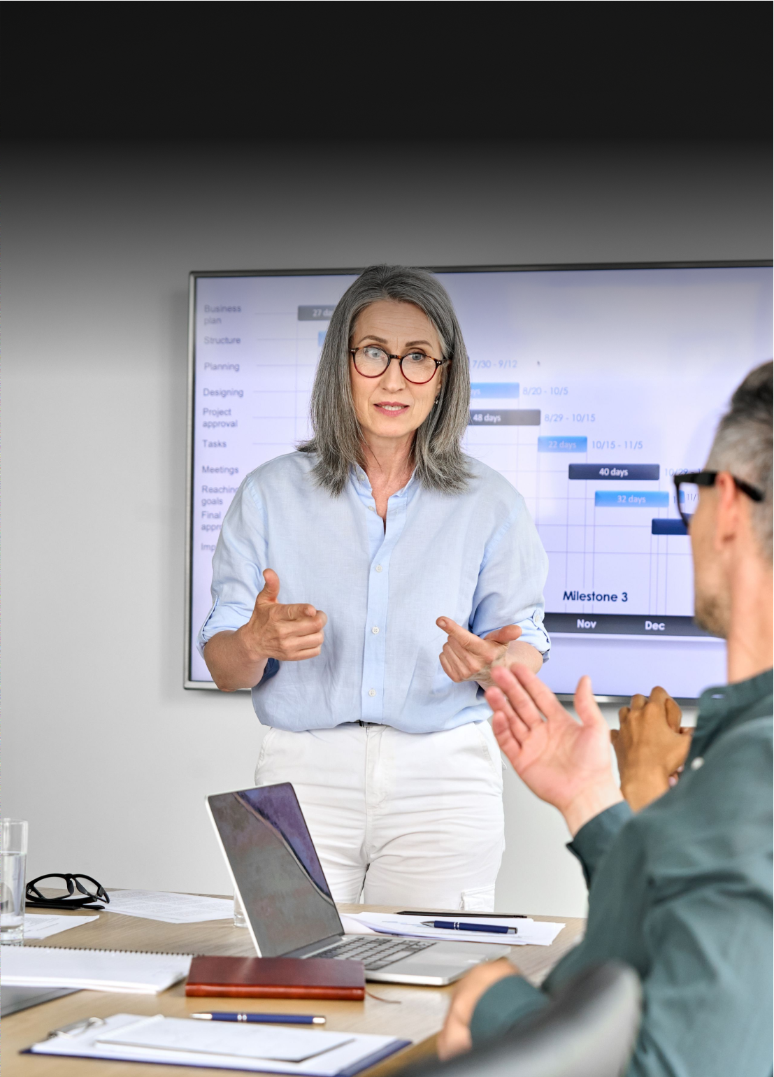 Woman presenting in a business meeting